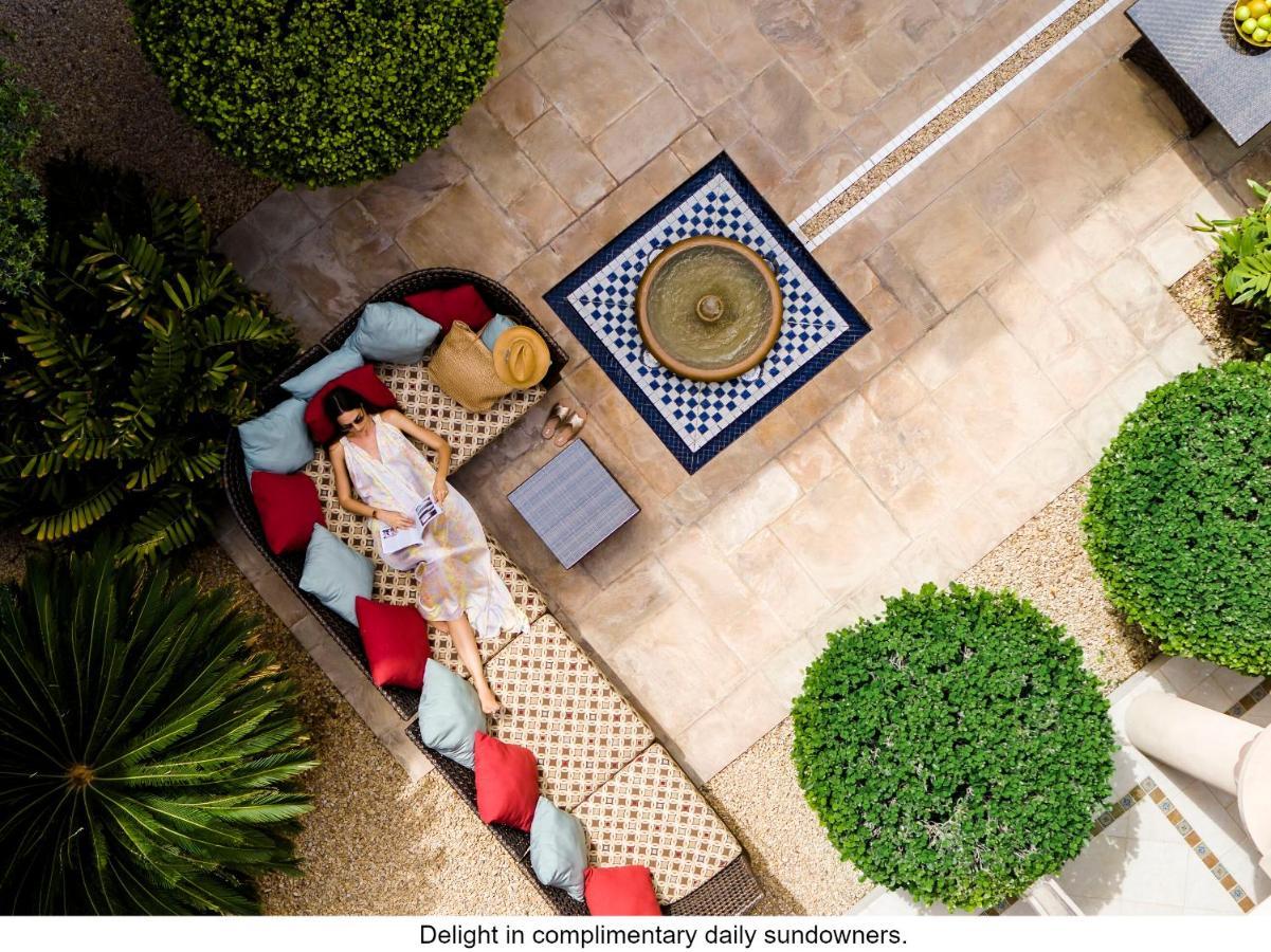 Jumeirah Dar Al Masyaf Dubai Exterior foto The courtyard at the Four Seasons Hotel, Marrakech